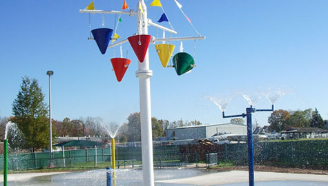 custom splash pad blended into existing landscape